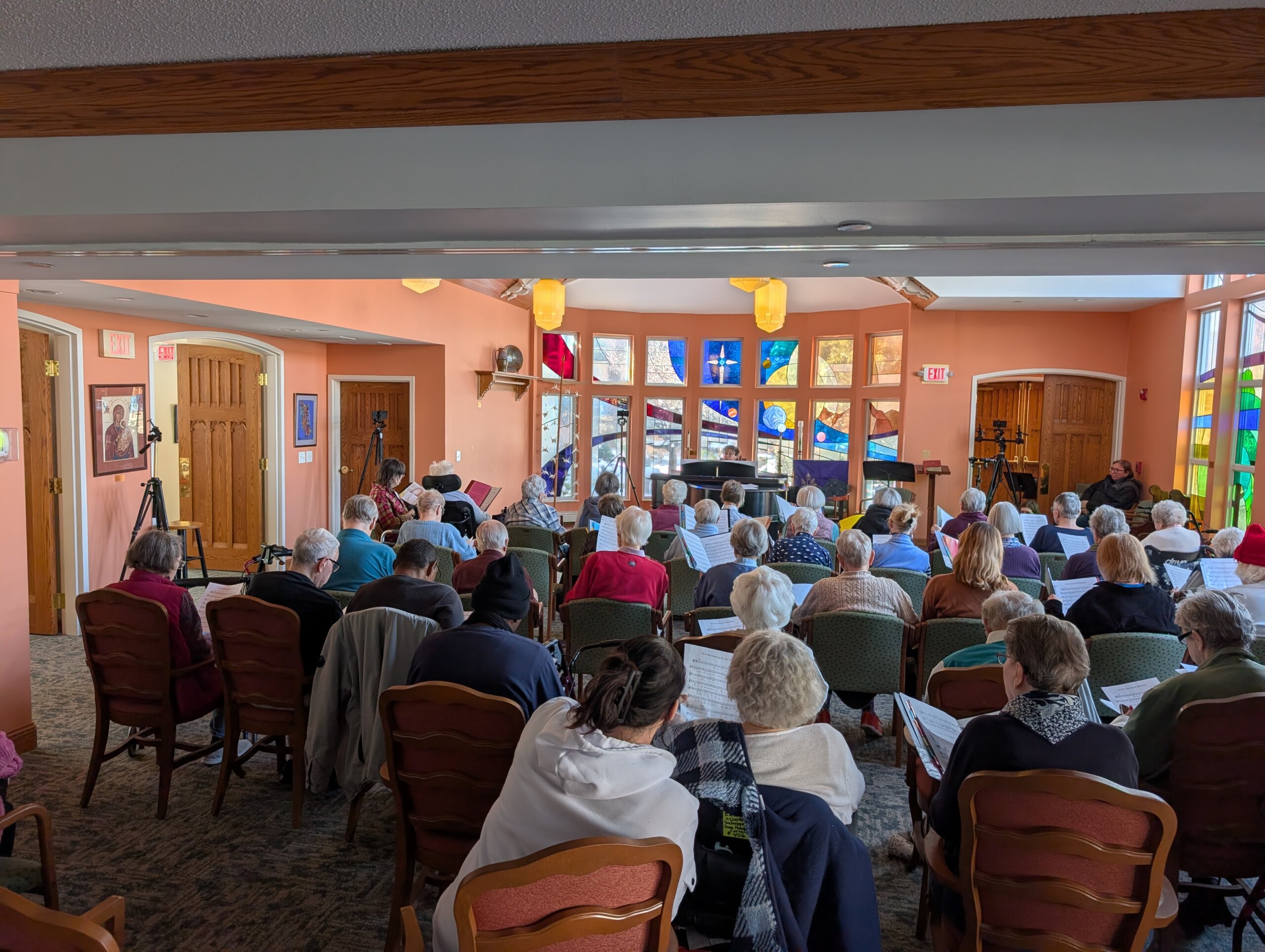 Residents gather at Episcopal Holmes for a recording session