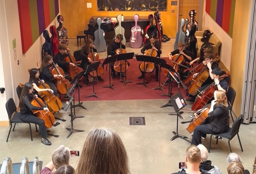 Students in Cello Rock perform for an audience in Gary Sipes auditorium at MacPhail.