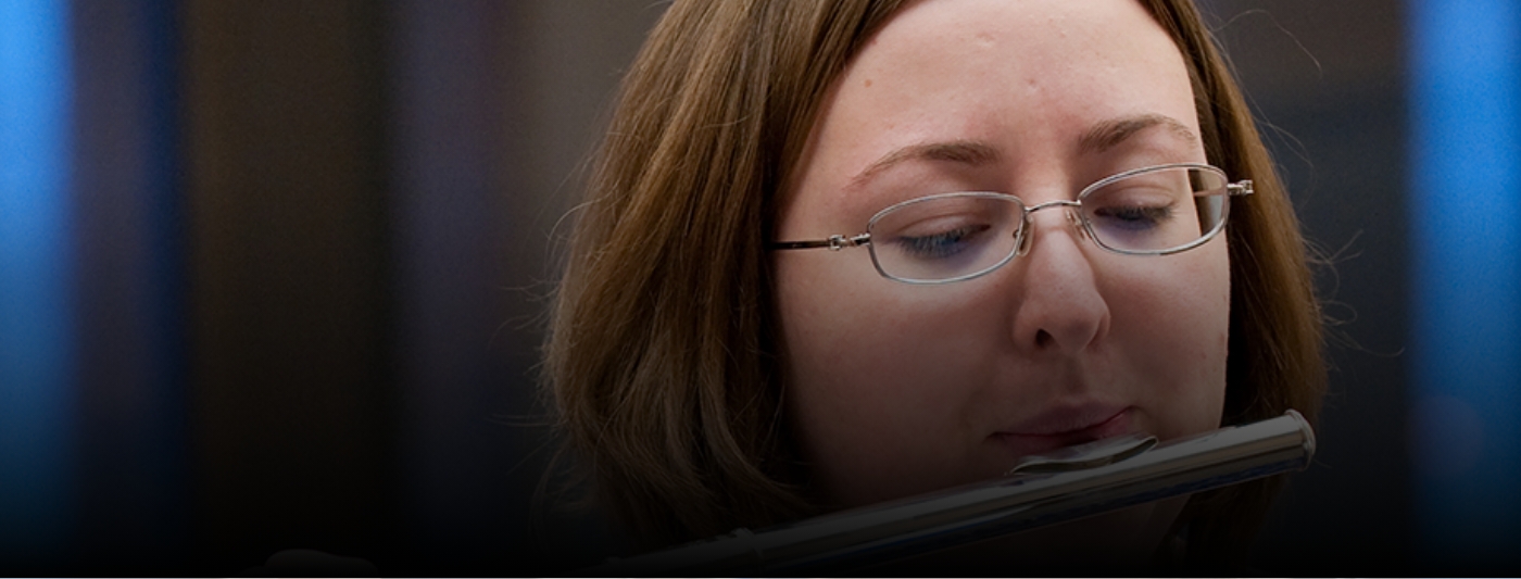 Adult playing flute